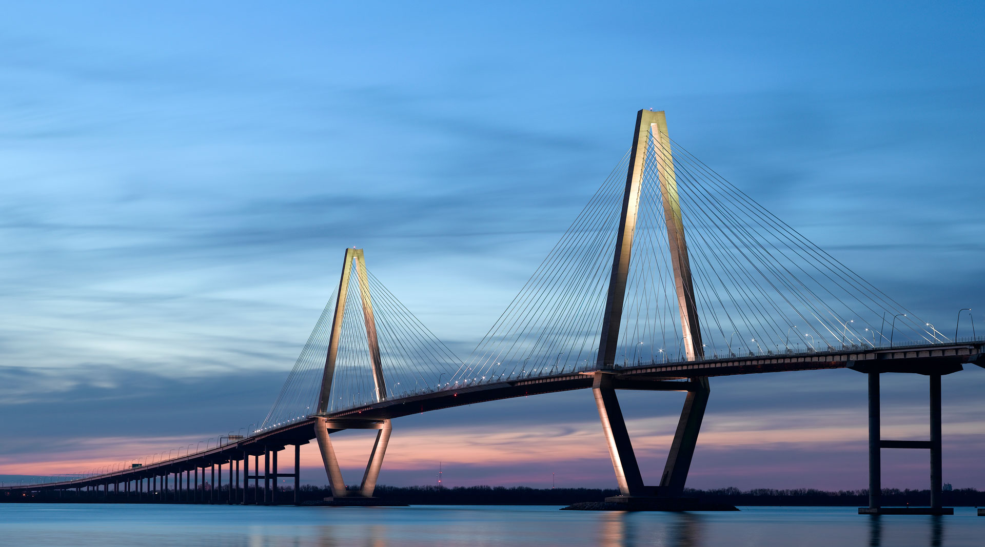 Large bridge over a body of water at night
