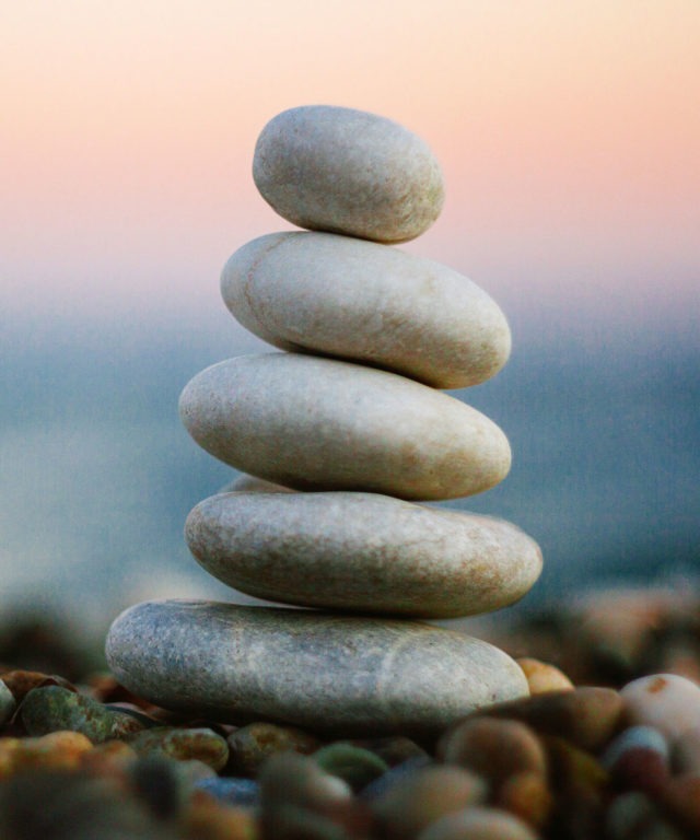 Five flat rocks stacked on top of each other