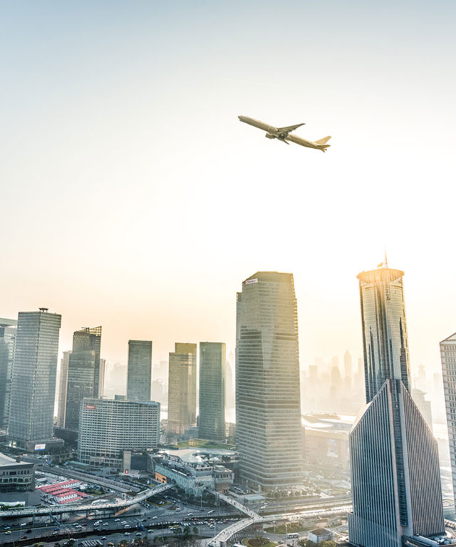 Airplane flying over a city