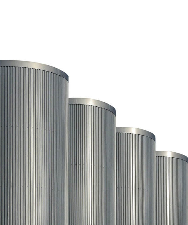 Four grey cylinders with ridges on the sides in a line