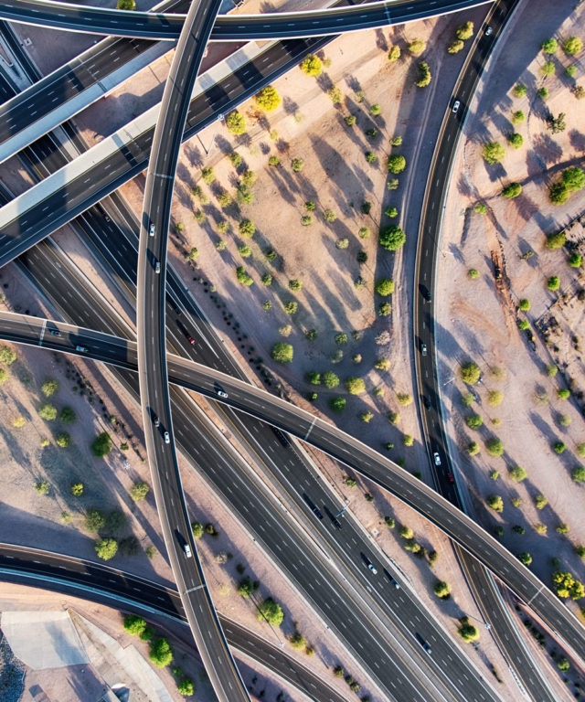 Bird's-eye view of several highways and overpasses with cars on them