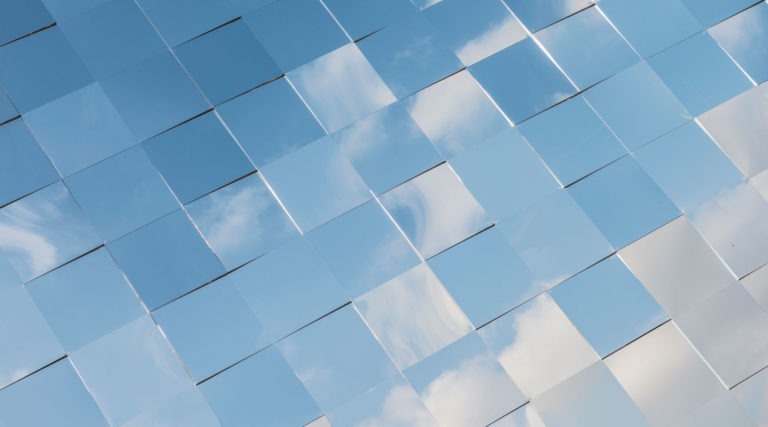 Mirror tiles reflecting a blue sky