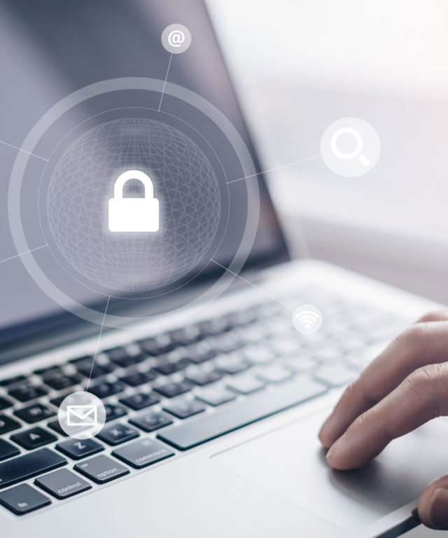 Laptop with a hand over the mouse pad and a transparent overlay of a lock graphic connected to other icons