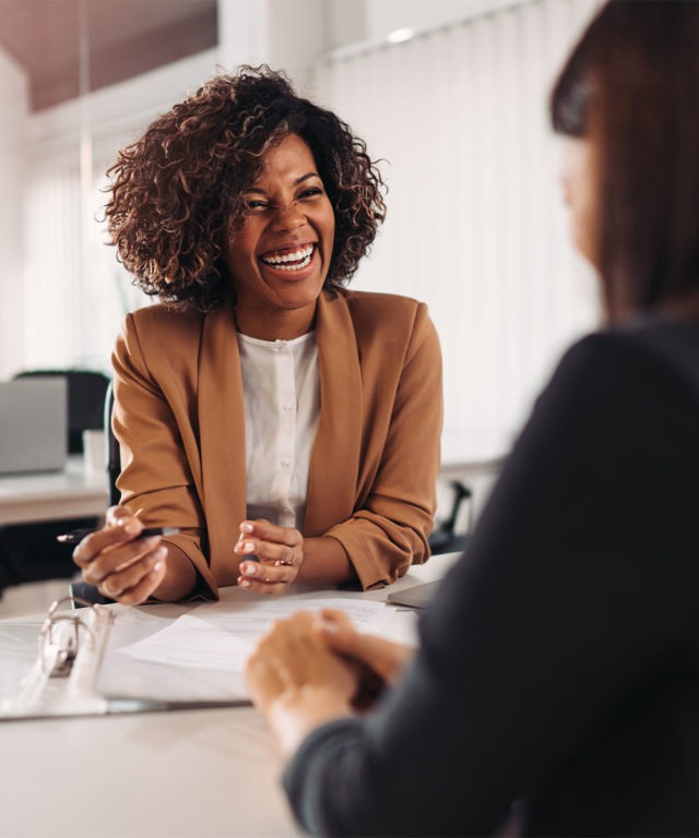 Two women talking in an office