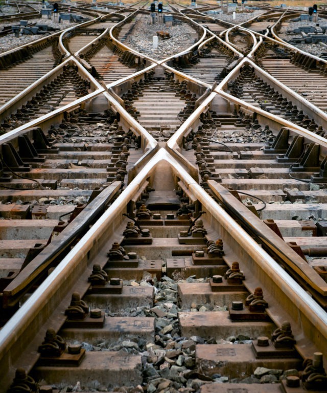 Up close view of several train tracks