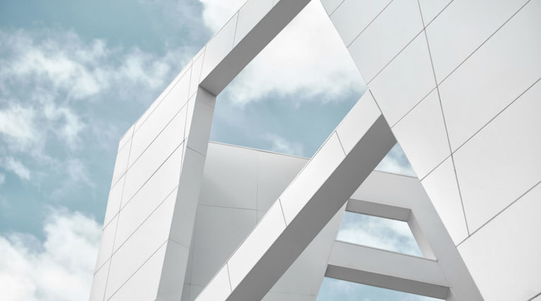 A partial show of the exterior of a white building