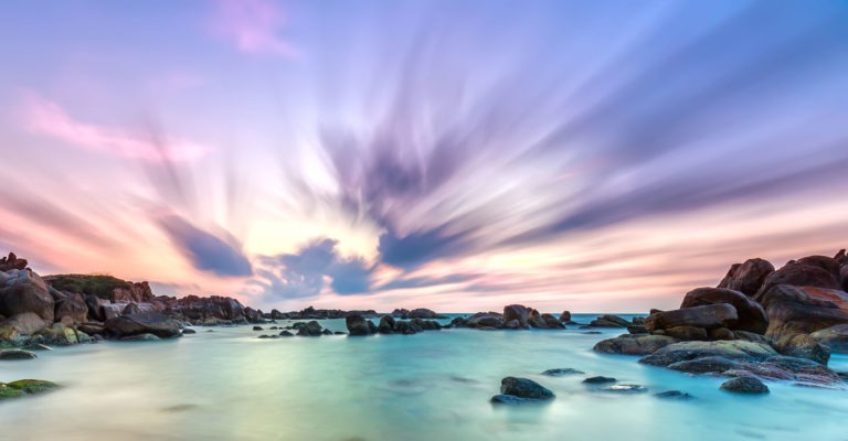 Shallow beach with colorful skies