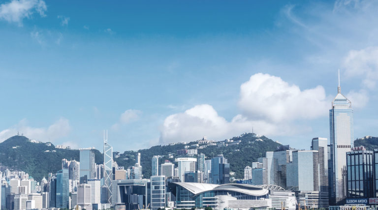 A cityscape with a blue sky