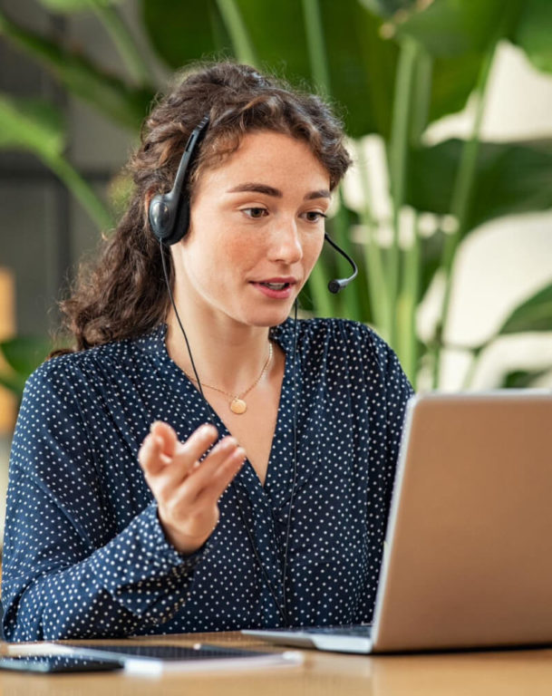 Businesswoman with headset on talking on a video call