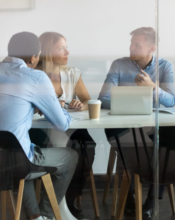 A group of coworkers in an office talking