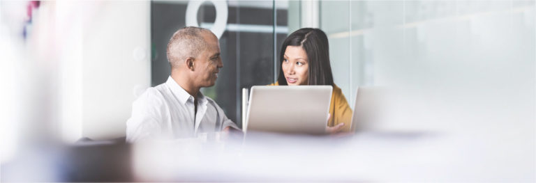Business people talking at a large conference table