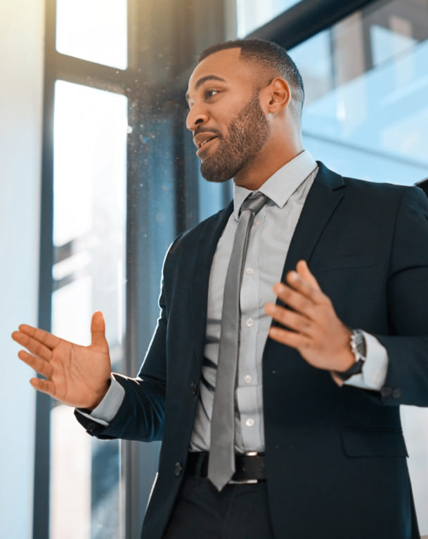 Businessman presenting data on a screen during a meeting in an office
