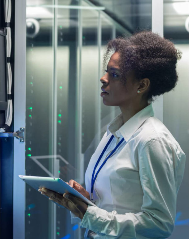 Technician looking at a data center computer