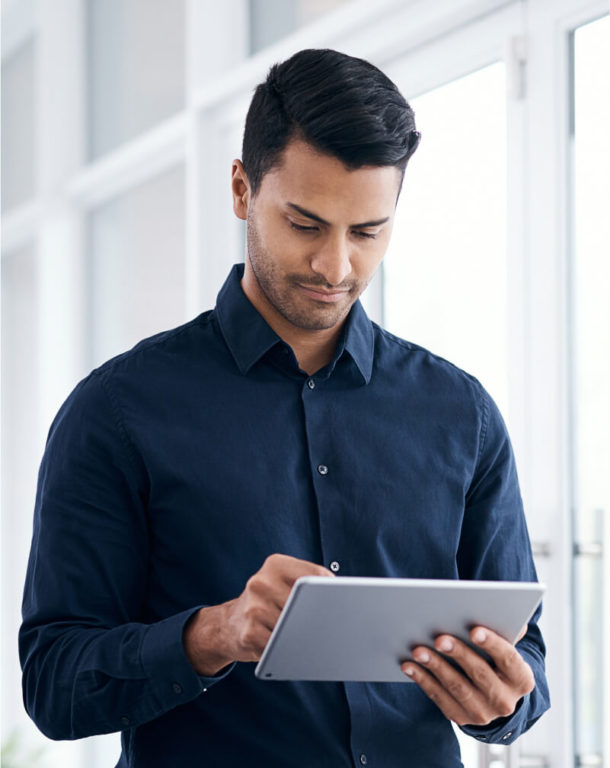 Man using tablet in a bright office