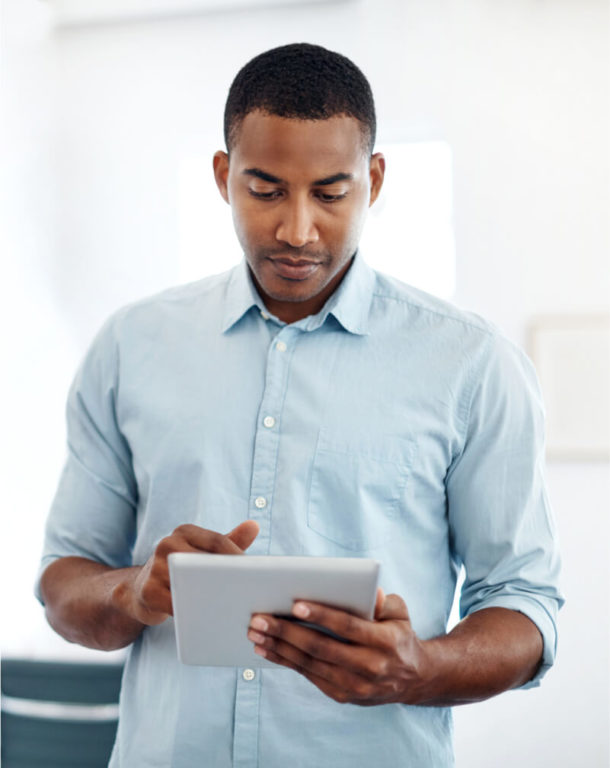 Man using a tablet in a bright office