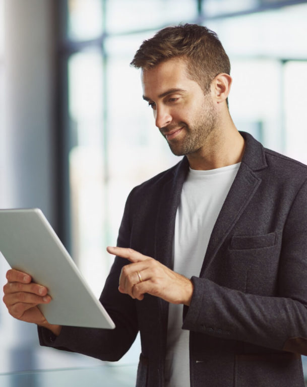 Man pointing at a sheet of paper in an office