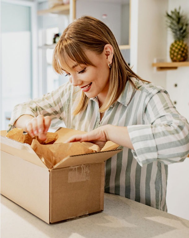 Woman opening package