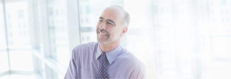 Man standing in office window
