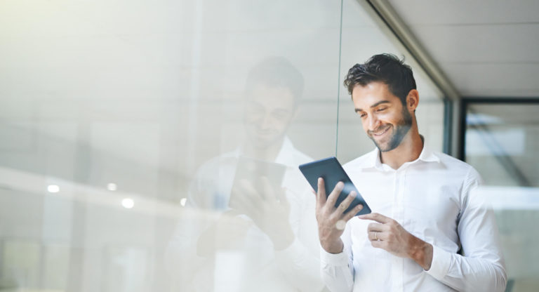Businessman holding his tablet