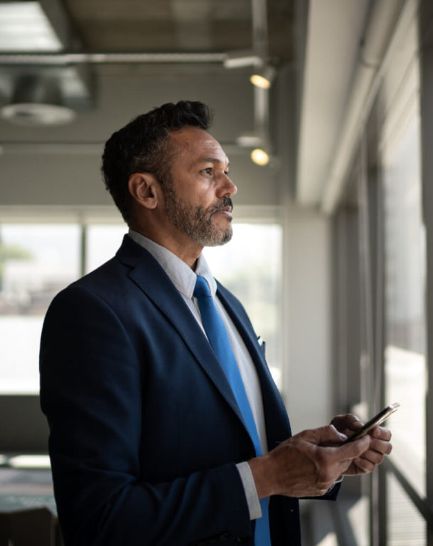 Businessman looking out an office window