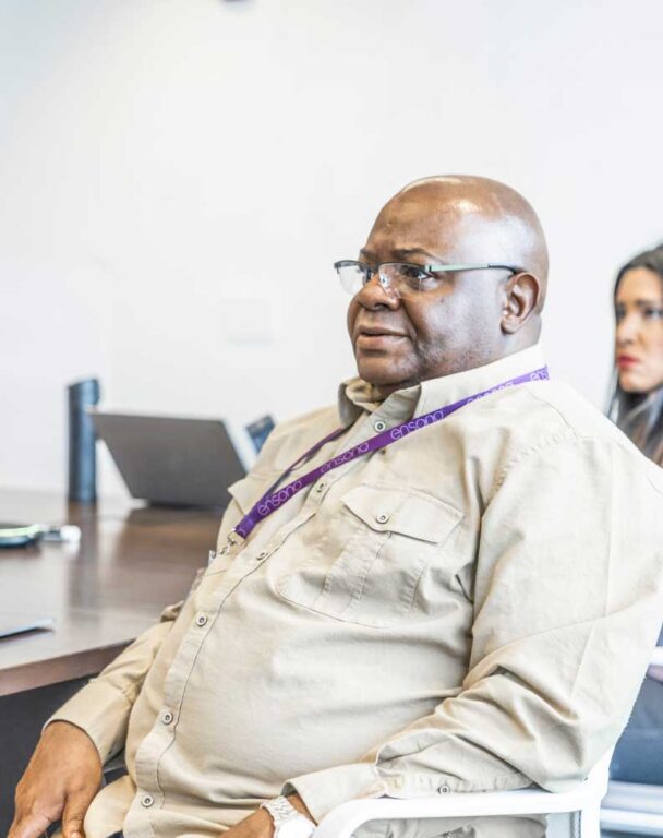 Ensono employee sitting in a meeting