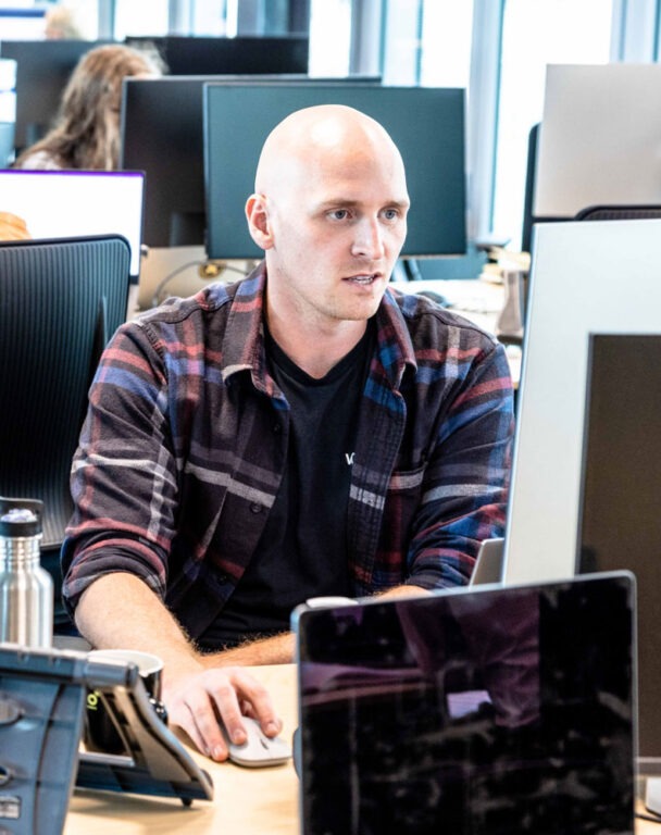 Person talking to computer at the office