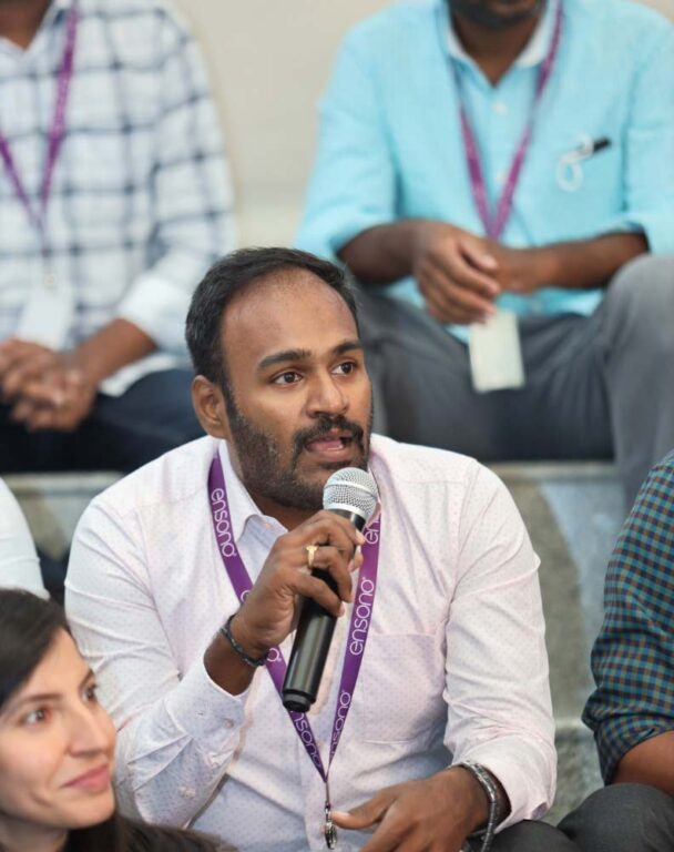 Ensono employee speaking into microphone
