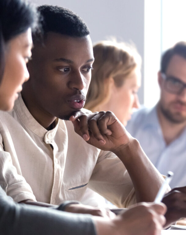People talking at a desk