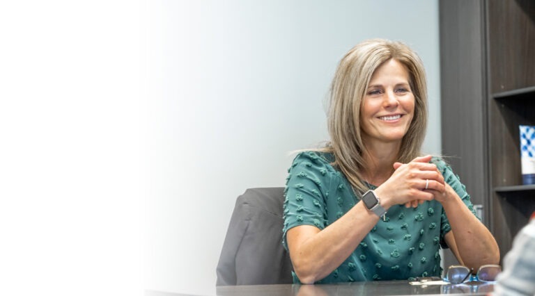 Person smiling at office desk