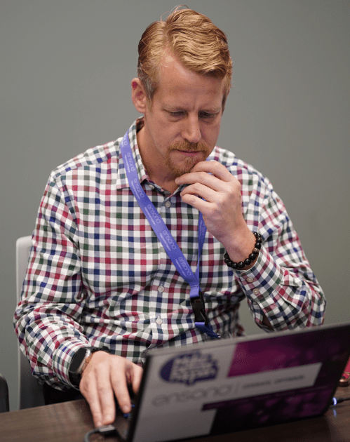 Male Ensono employee concentrating 